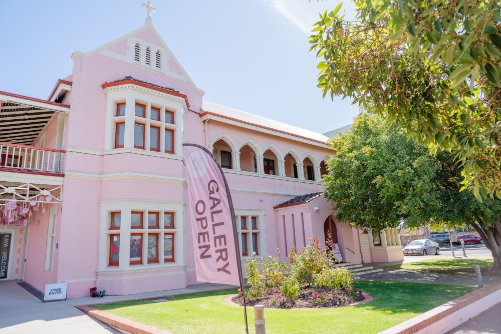 Exterior of a pink two story building