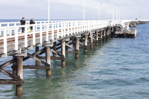 White jetty stretching out into the ocean