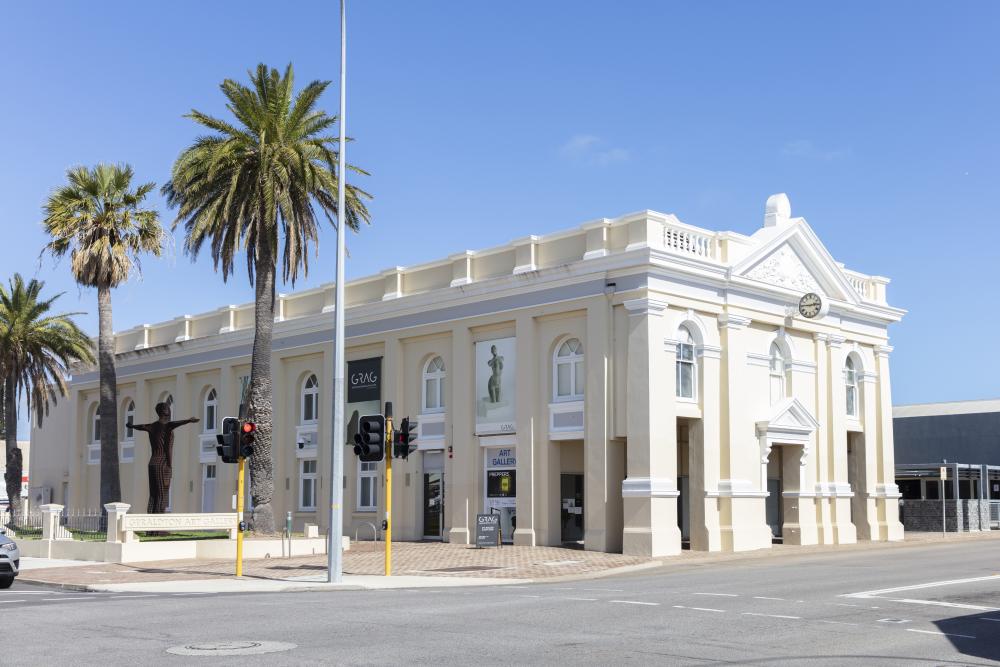 A white and cream heritage building on a street corner