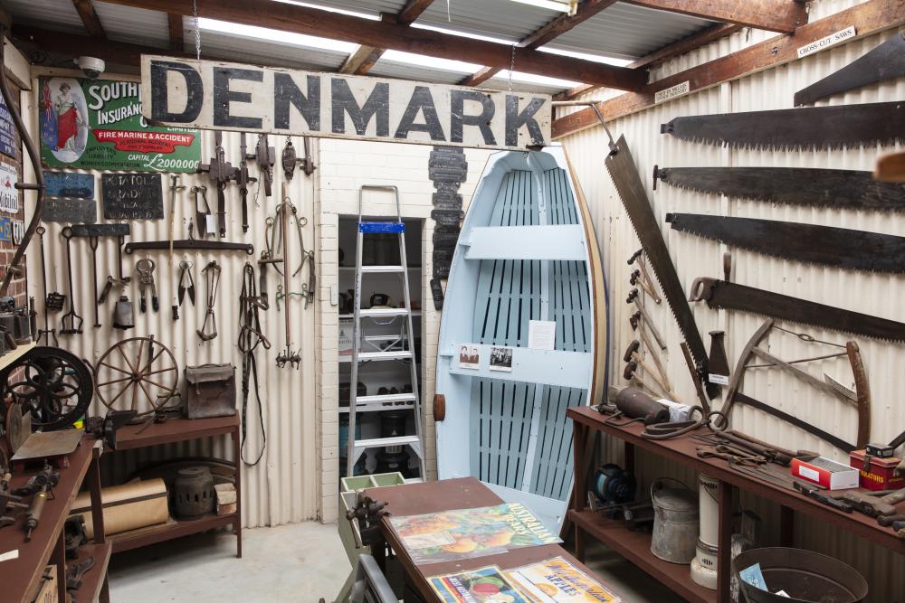 A room with many vintage objects on the wall