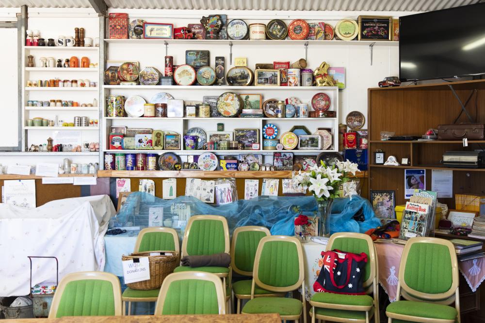 A room with many vintage items on the shelves