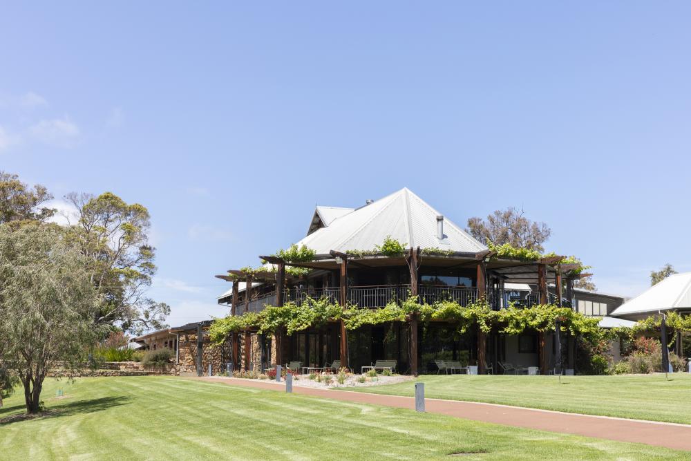 Photograph of two story building with greenery at Vasse Felix winery
